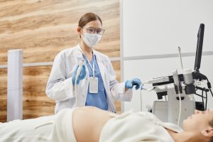 Female Doctor Performing Ultrasound Exam